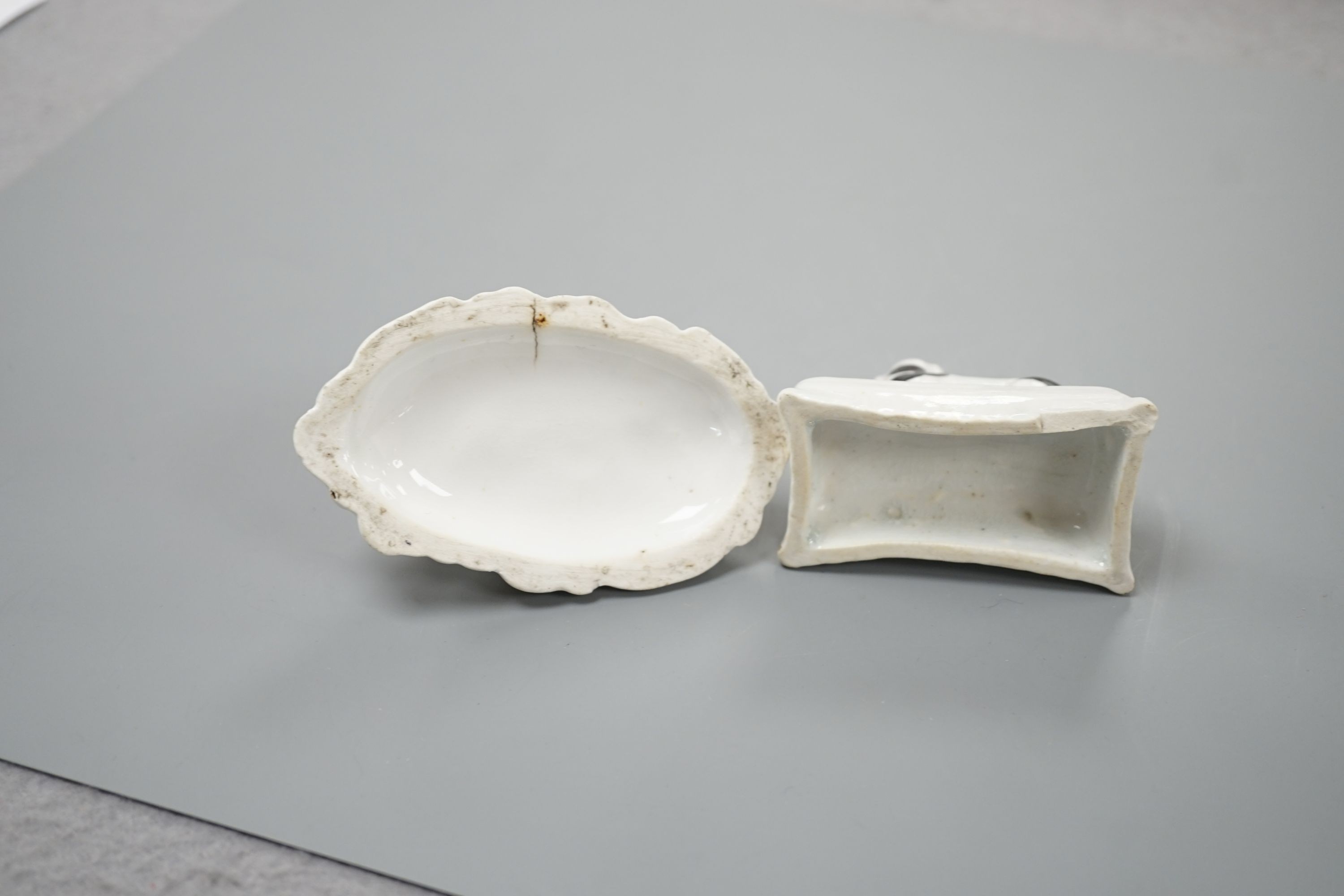 Two Staffordshire porcelain models of recumbent king Charles spaniel‘s, c.1835-50, largest 8.2 cm long, Cf. Dennis G.Rice Dogs in English porcelain, colour plate 146., Provenance: Dennis G.Rice collection
